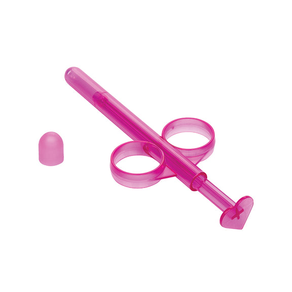 The Lube Tube sitting out, zoomed in on the base of the Lube Tube to showcase the heart-shaped plunger. | Kinkly Shop